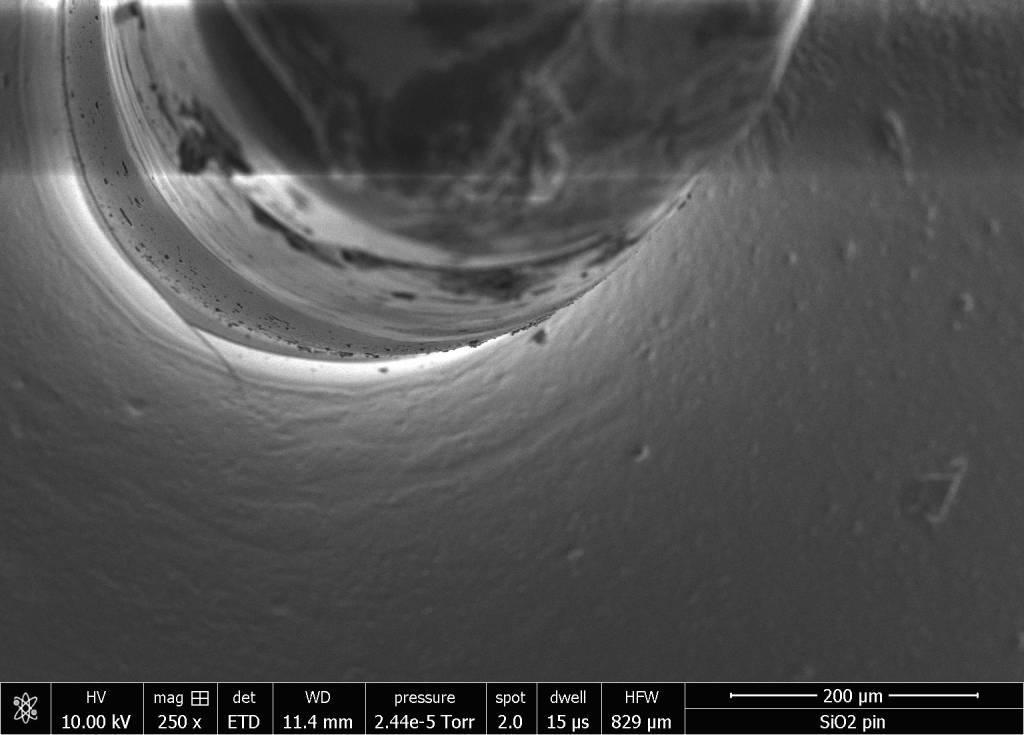 Zoomed in electron microscope photo of fiber optic pin.